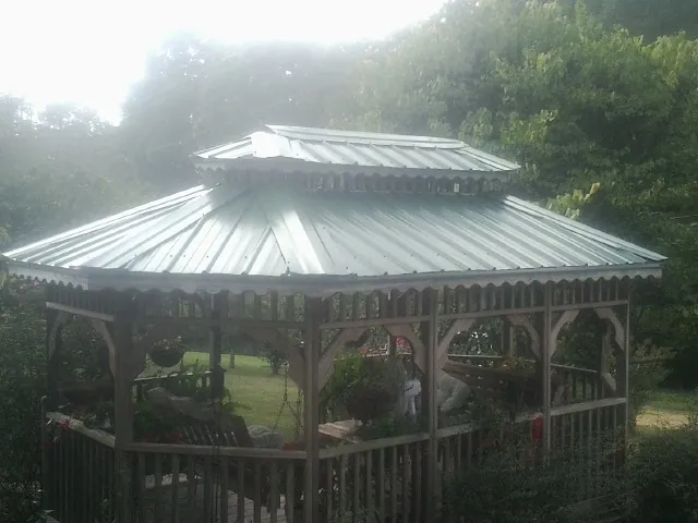 Two tier green metal roof on a garden gazebo in Red Feather Lakes
